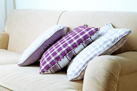 Colorful pillows on sofa, close-upの写真素材