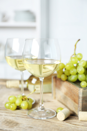 Still life of wine and bread on light backgroundの写真素材