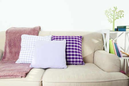 Colorful pillows on sofa, close-upの写真素材