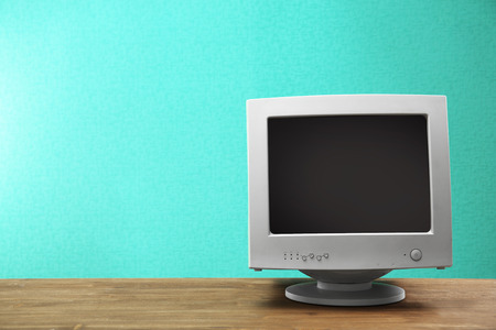 Obsolete computer set on light blue backgroundの写真素材