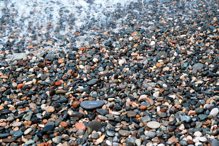 Wet pebbles on sea beachの写真素材