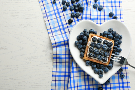 Gourmet fresh blueberry tart on plate, close upの写真素材