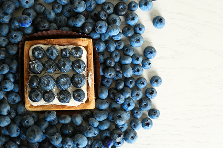 Gourmet fresh blueberry tart on table