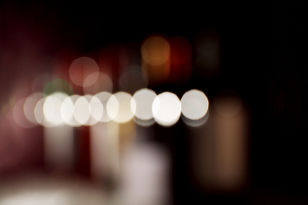 unfocused wine bottles on black backgroundの写真素材