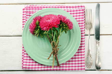 Summer table setting  on color wooden backgroundの写真素材