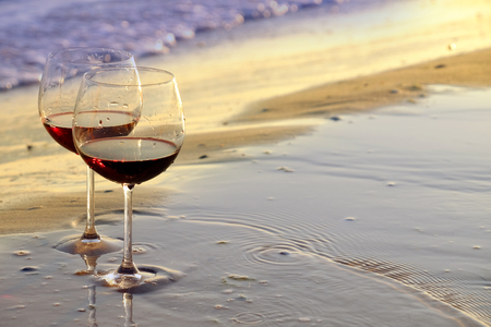 Two wineglasses on the seashore