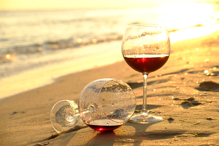 Two wineglasses on the seashoreの写真素材