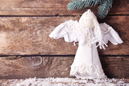 Christmas angel on wooden backgroundの写真素材