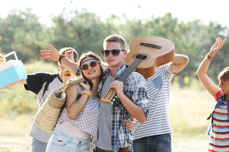 A group of joyful friends having fun outdoorsの写真素材