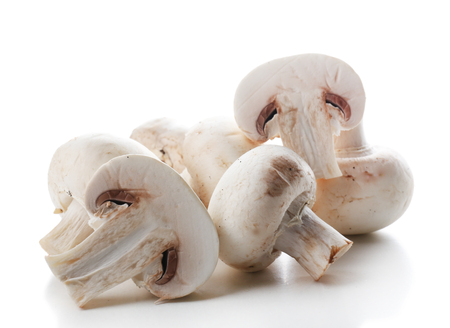 A bunch of champignon mushrooms isolated on white backgroundの写真素材