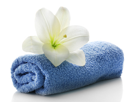 Blue towel with flower isolated on white backgroundの写真素材