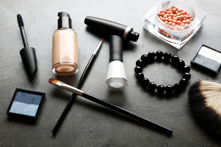 Different cosmetics on dark grey backgroundの写真素材
