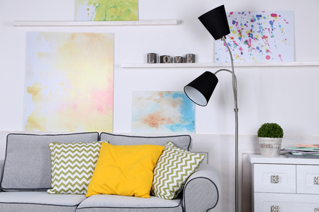 Beautiful modern living room with grey sofa and floor lampの写真素材