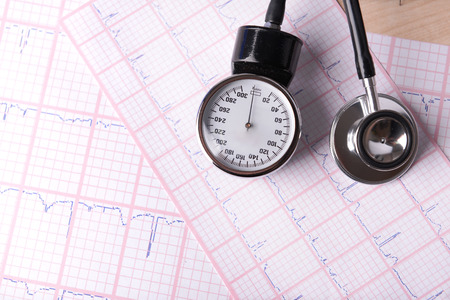 Blood pressure meter, digital tablet and stethoscope, on wooden backgroundの写真素材