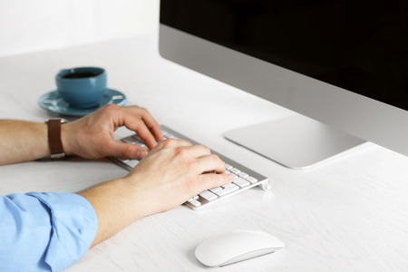 Man working with computer in officeの写真素材