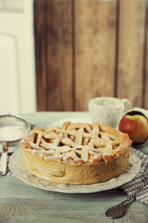Homemade apple pie on wooden backgroundの写真素材