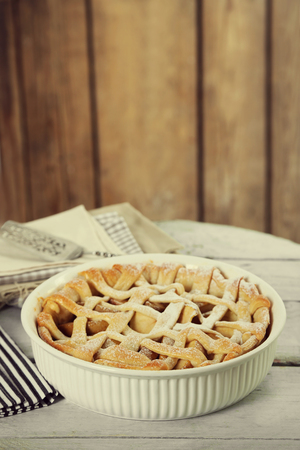 Homemade apple pie on wooden backgroundの写真素材