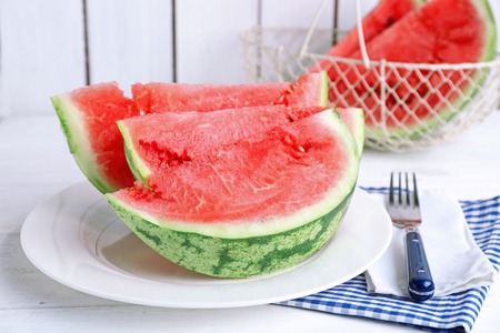 Sliced watermelon on white plateの写真素材