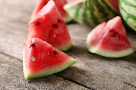 Fresh sliced watermelon wooden backgroundの写真素材