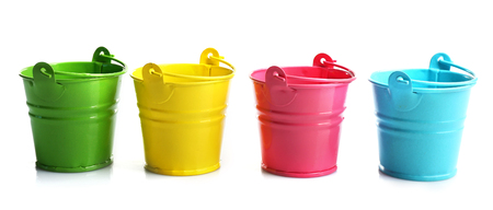 Four buckets of different colours, isolated on whiteの写真素材