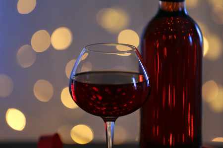 Wine and Christmas decoration on bright backgroundの写真素材