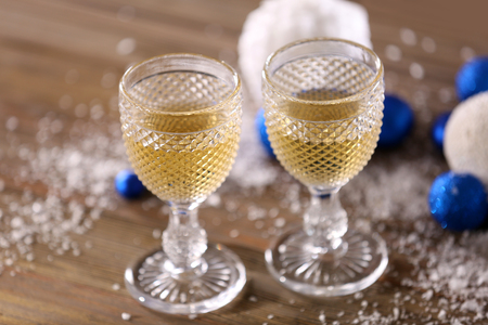 Champagne and Christmas decoration on wooden tableの写真素材