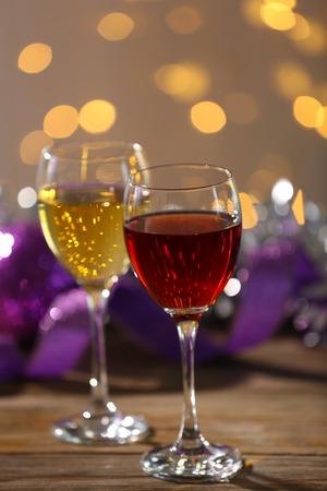Wine and Christmas decoration on bright backgroundの写真素材