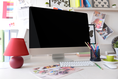 Modern computer on the table in decorated roomの写真素材