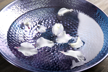 Flower petals in plate with water closeupの写真素材