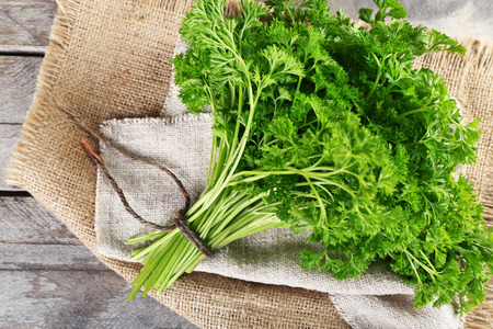 Fresh parsley on sackcloth napkinの写真素材