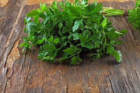 Fresh parsley on wooden backgroundの写真素材