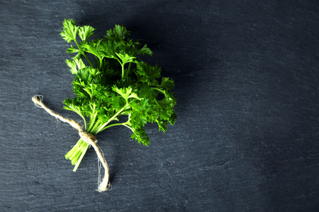 Fresh parsley on dark grey backgroundの写真素材