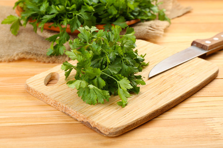 Fresh parsley on wooden cutting boardの写真素材