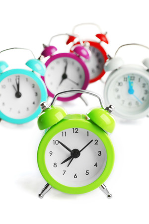 A group of alarm clocks, isolated on whiteの写真素材