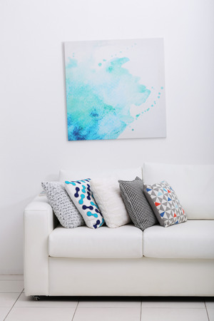 Sofa with colorful pillows in roomの写真素材