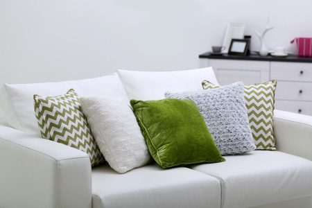 Sofa with colorful pillows in roomの写真素材