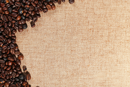 Frame of roasted coffee beans on the linen fabricの写真素材