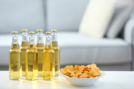 Table at home with chips and drinks for friendsの写真素材