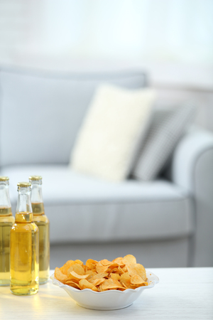 Table at home with chips and drinks for friendsの写真素材