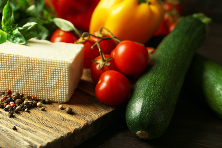 Fresh ingredients for preparing zucchini rolls on wooden background の写真素材