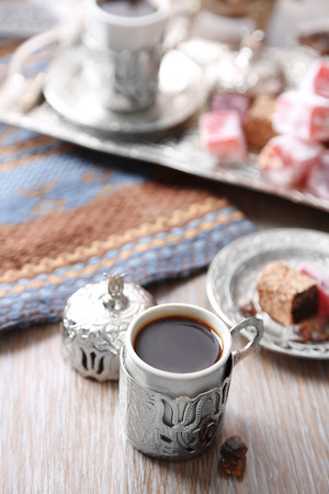 Antique tea-set with Turkish delight on table close-upの写真素材