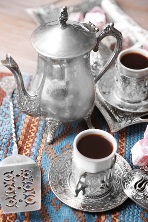 Antique tea-set with Turkish delight on table close-upの写真素材
