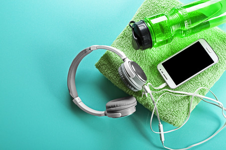 Headphones and sport equipment on blue backgroundの写真素材