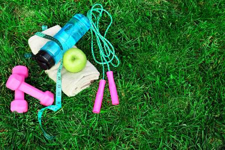 sports equipment on green grass backgroundの写真素材