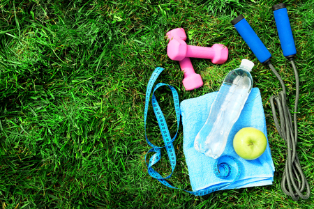 sports equipment on green grass backgroundの写真素材