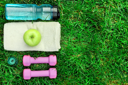 sports equipment on green grass backgroundの写真素材