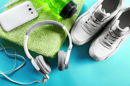 Headphones and sport equipment on blue backgroundの写真素材