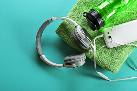Headphones and sport equipment on blue backgroundの写真素材