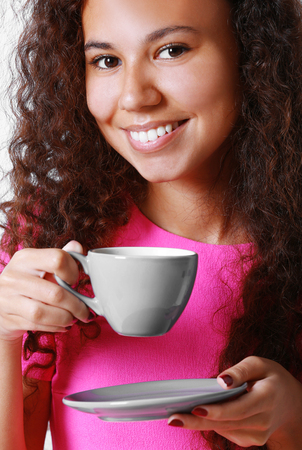 Pretty young woman drinking coffee, close upの写真素材