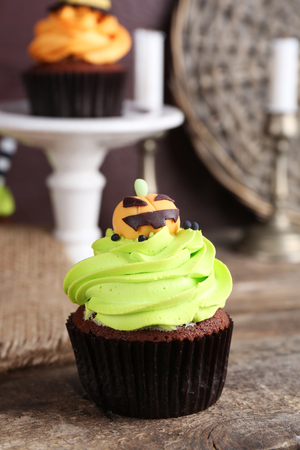 Halloween cupcakes on wooden tableの写真素材